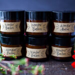 How to make a luscious, creamy Shea Butter Body Balm to sooth dry winter skin, tame locks, heal cracked lips, and moisturize dry hands and feet. Made with simple all natural ingredients, scented with your choice of essential oils. #balm #salve #bodybutter