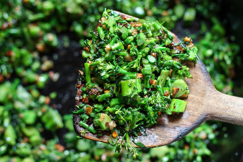 Sauteing the chopped broccoli.