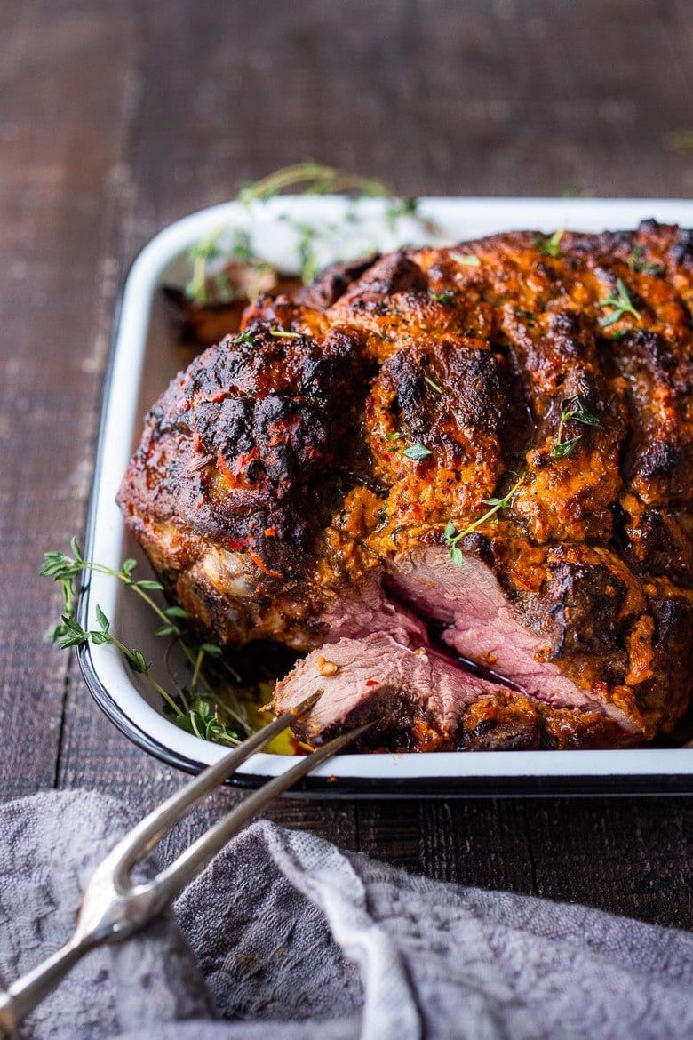 A simple recipe for Leg of Lamb with a Harissa Yogurt Crust. This bone-in lamb leg yields a beautiful flavorful crust with juicy tender meat. 