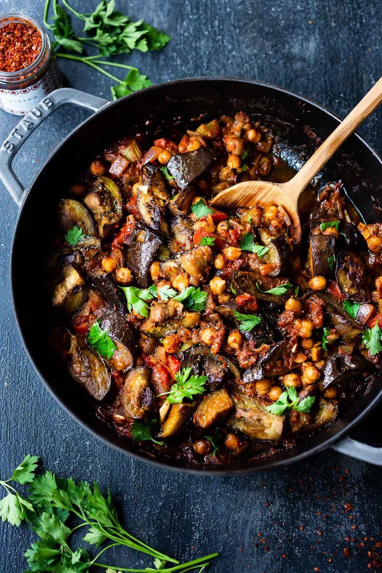 Delicious, Healthy Tagine Recipe with Eggplant and Chickpeas- seasoned with Moroccan spices and served over couscous. A simple plant-based dinner recipe! #tagine