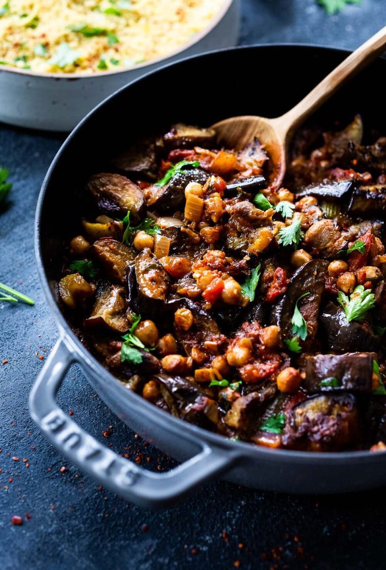 Delicious, Healthy Tagine Recipe with Eggplant and Chickpeas- seasoned with Moroccan spices and served over couscous. A simple plant-based dinner recipe! #tagine