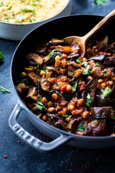 Delicious, Healthy Tagine Recipe with Eggplant and Chickpeas- seasoned with Moroccan spices and served over couscous. A simple plant-based dinner recipe! #tagine