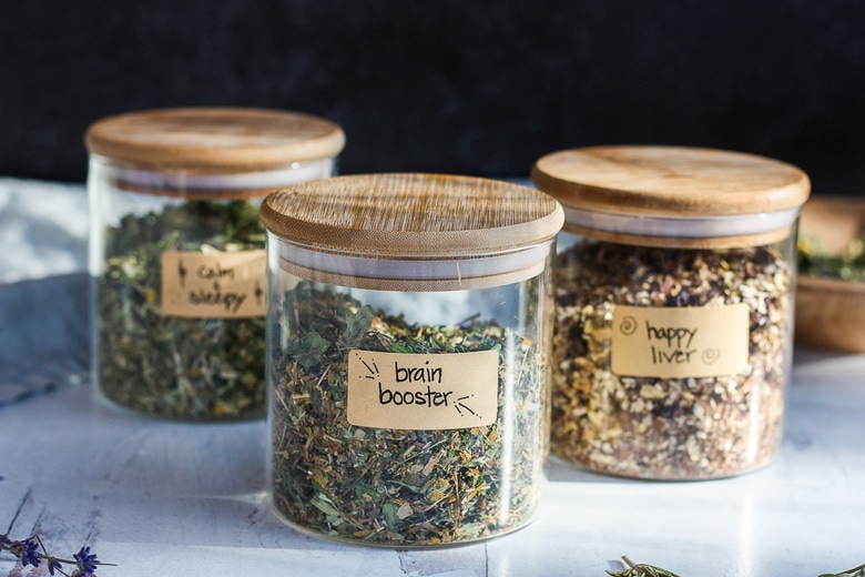 The Benefits of drinking Herbal Tea plus 3 Herbal Tea Recipes ( Brain Booster Tea, Happy Liver Tea and Calm and Sleepy Tea) you can make at home for sleep, brain function and liver support. Easy and adaptable, these herbal tea blends are nutritive and soothing. #herbaltea #tea #herbtea