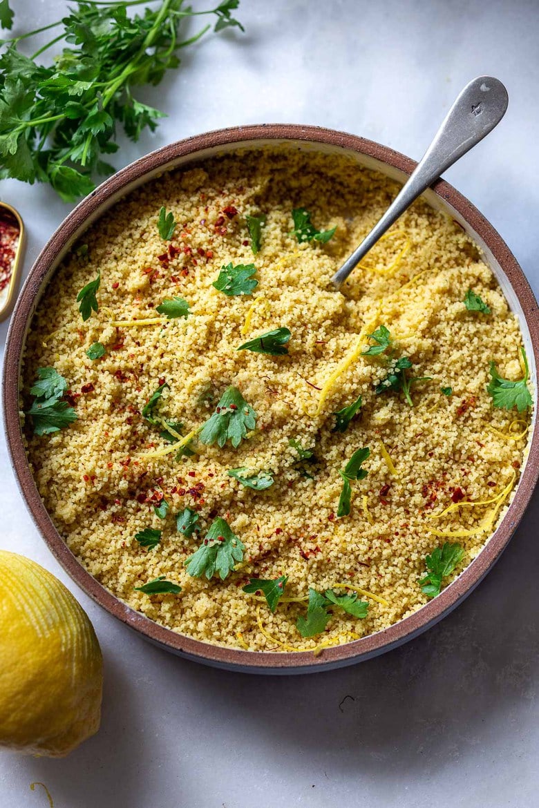 How to cook Couscous - a quick and easy recipe with three different flavor variations! Couscous is a North African (or Berber) sidedish of tiny steamed balls of crushed durum wheat that is traditionally served with flavorful tagines and stews. #couscous 