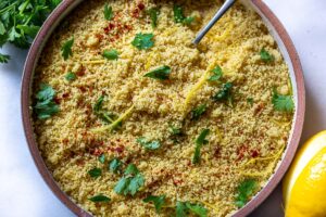 How to cook Couscous - a quick and easy recipe with three different flavor variations! Couscous is a North African (or Berber) sidedish of tiny steamed balls of crushed durum wheat that is traditionally served with flavorful tagines and stews. #couscous