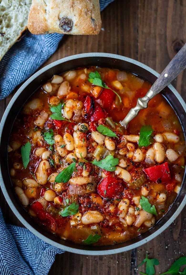 Smoky Tomato White Bean Soup you can make in your Instant Pot or on the stovetop using dry beans. Smoked paprika and optional Harissa paste give it a delicious flavor that will have you coming back for seconds. Low in calories, high in fiber, this soup is vegan and gluten-free.