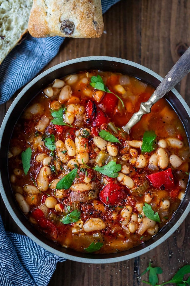 Smoky Tomato White Bean Soup you can make in your Instant Pot or on the stovetop using dry beans. Smoked paprika and optional Harissa paste give it a delicious flavor that will have you coming back for seconds.  Low in calories, high in fiber, this soup is vegan and gluten-free.