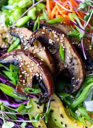 Miso Mushroom Bowl with brown rice, avocado, cabbage, carrots, daikon, edamame and a Miso Ginger Dressing. Vegan and Gluten free.