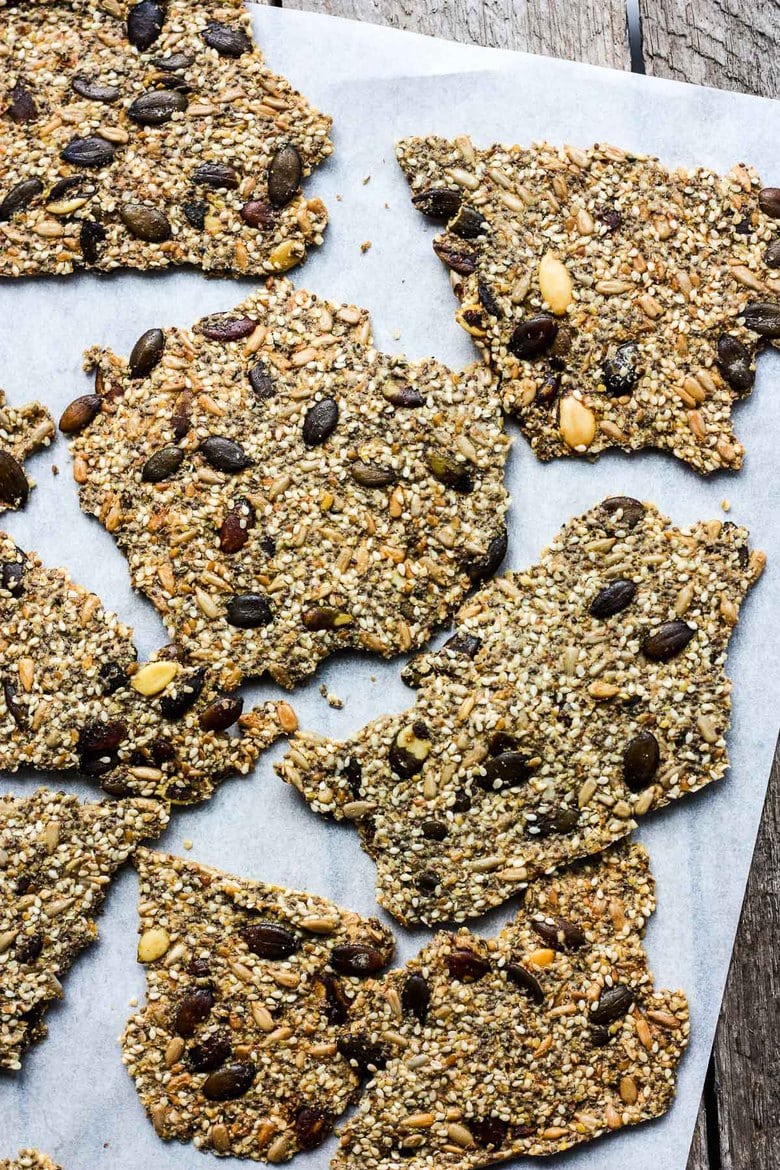 Light and crisp, these Rustic Seed Crackers are keto, gluten-free and vegan.  This recipe is incredibly easy, flexible, adaptable and full of toasty rich flavor.  They are the perfect snack by themselves, and pair with most toppings.