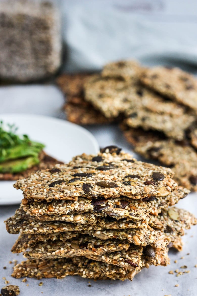 Light and crisp, these Rustic Seed Crackers are keto, gluten-free and vegan.  This recipe is incredibly easy, flexible, adaptable and full of toasty rich flavor.  They are the perfect snack by themselves, and pair with most toppings.