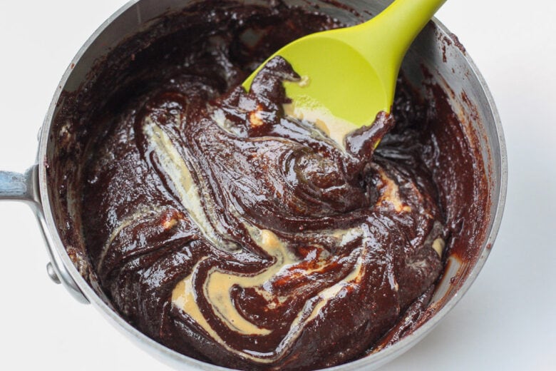 Tahini added into the chocolate mixture in the sauce pan.