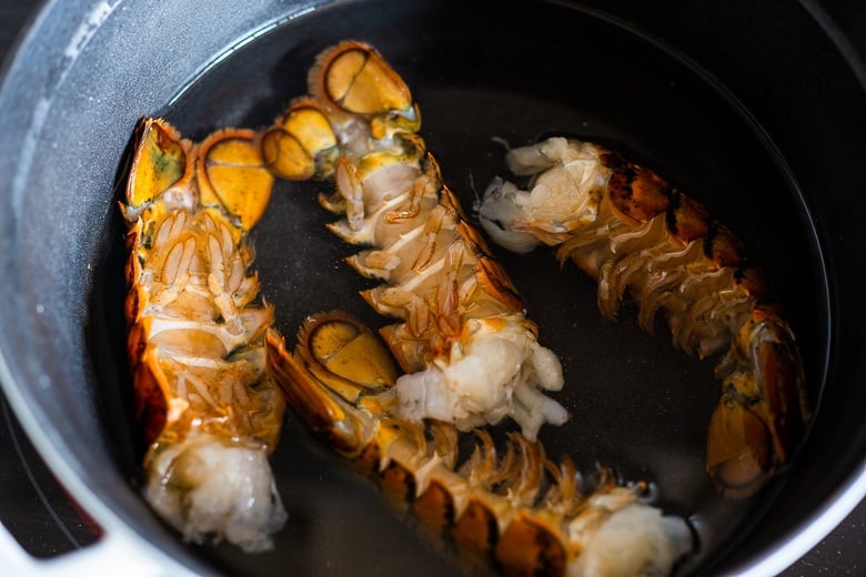 simmer 1 ¼ lbs of lobster tails in salted water. 