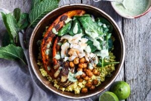 Here is one of our favorite millet recipes!  Coconut Millet Bowls with berbere-spiced kabocha squash, chickpeas, shallots, and spinach, drizzled with a coconut lime sauce. Packed full of flavor this vegan, plant-based meal,  is wholesome and nourishing!