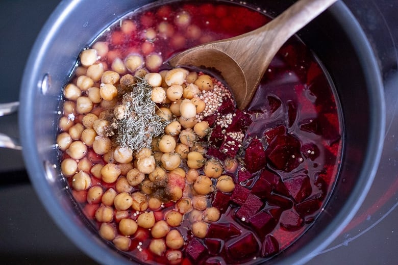 add quinoa, beets chickpeas, water salt and spices to the pot. 