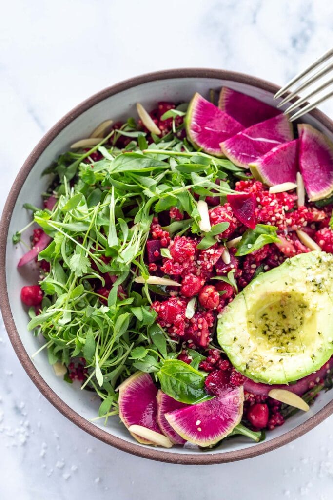 Brighten up your day with this Winter Bliss Bowl! A simple vegan bowl made with beets, quinoa, avocado and chickpeas-that can be made in under 30 minutes! Great for meal-prepping and guaranteed to lift your spirits! #bowl #buddhabowl #veganbowl #