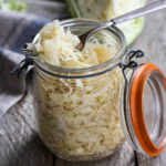 Making homemade Sauerkraut is easier than you think! Full of healthy probiotics that support our gut and boost our immune system, sauerkraut is fermented cabbage that takes under 30 minutes of hands-on time before mother nature takes over!