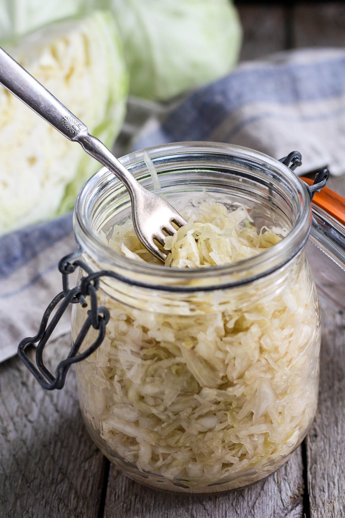 How to make Simple Cultured Cabbage!  Aka Sauerkraut- a delicious tangy addition to many dishes. Brimming with gut-healing probiotics, fermented cabbage is easy to make at home with just two ingredients!  
