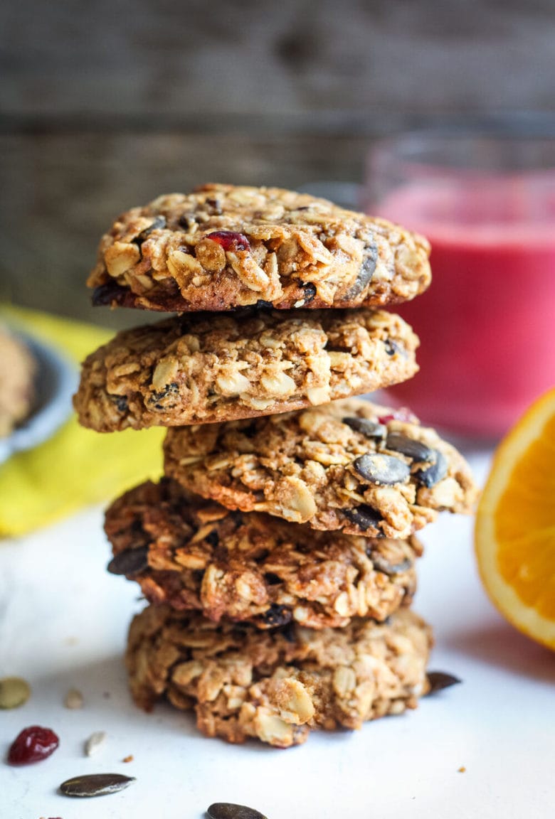 These healthy Breakfast Cookies can be made in under 30 minutes! They are chockfull of flavor and sustenance -filled with oats, seeds, spices and dried fruit they are vegan and deliciously addicting! Perfect for breakfast on the go. #breakfastcookie