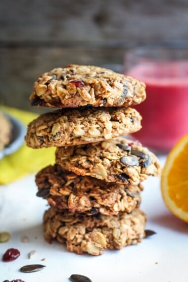 These healthy Breakfast Cookies can be made in under 30 minutes! They are chockfull of flavor and sustenance -filled with oats, seeds, spices and dried fruit they are vegan and deliciously addicting! Perfect for breakfast on the go. #breakfastcookie