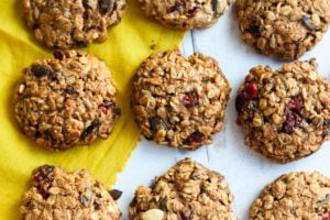 These healthy Breakfast Cookies can be made in under 30 minutes! They are chockfull of flavor and sustenance -filled with oats, seeds, spices and dried fruit they are vegan and deliciously addicting! Perfect for breakfast on the go. #breakfastcookie