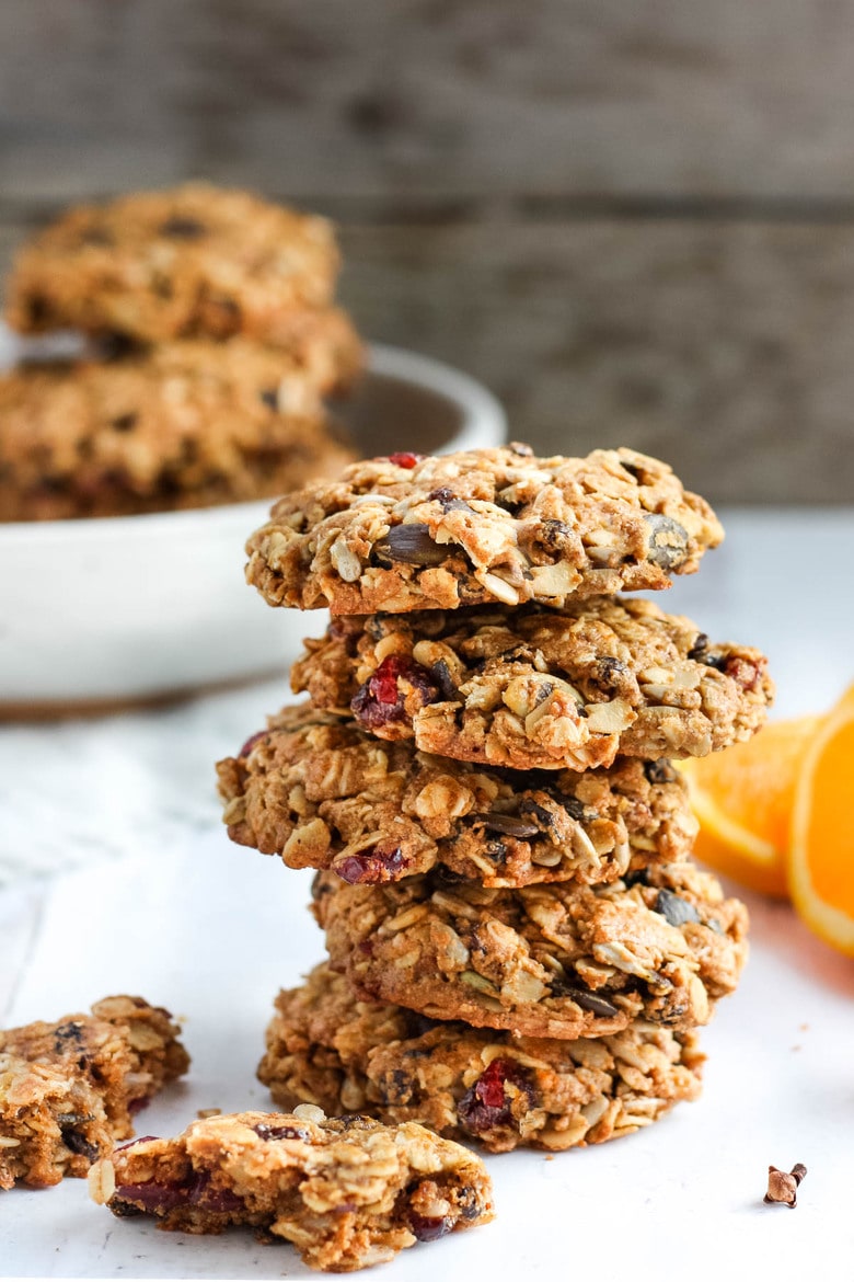 These healthy Breakfast Cookies can be made in under 30 minutes! They are chockfull of flavor and sustenance -filled with oats, seeds, spices and dried fruit they are vegan and deliciously addicting! Perfect for breakfast on the go. #breakfastcookie