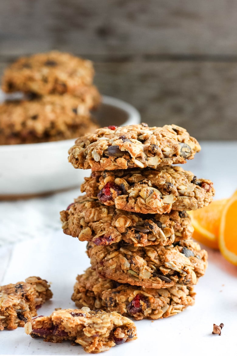 These healthy Breakfast Cookies can be made in under 30 minutes! They are chockfull of flavor and sustenance -filled with oats, seeds, spices and dried fruit they are vegan and deliciously addicting! Perfect for breakfast on the go. #breakfastcookie