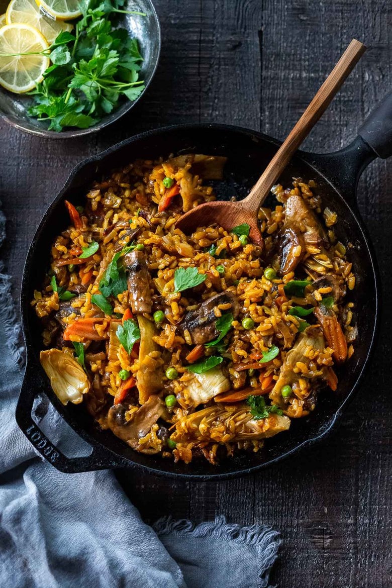 How to make authentic Vegetable Paella like they do in Spain! A simple, easy, vegetarian dinner recipe that comes together in under an hour! Vegetarian, vegan and gluten-free!