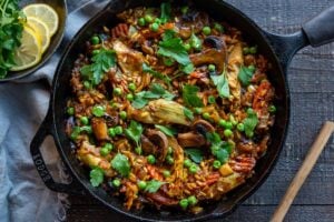 How to make authentic Vegetable Paella like they do in Spain! A simple, easy, vegetarian dinner recipe that comes together in under an hour! Vegetarian, vegan and gluten-free!