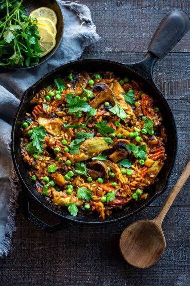 How to make authentic Vegetable Paella like they do in Spain! A simple, easy, vegetarian dinner recipe that comes together in under an hour! Vegetarian, vegan and gluten-free!