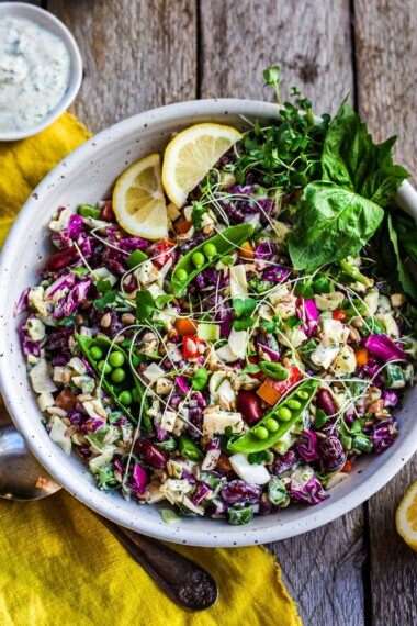 A deliciously crunchy and rainbow-colored Chopped Salad with cabbage, bell pepper, and kidney beans tossed in a yogurt dressing.  Perfect for lunch and dinner- this healthy salad keeps for 4 days in the fridge. Vegan-adaptable.