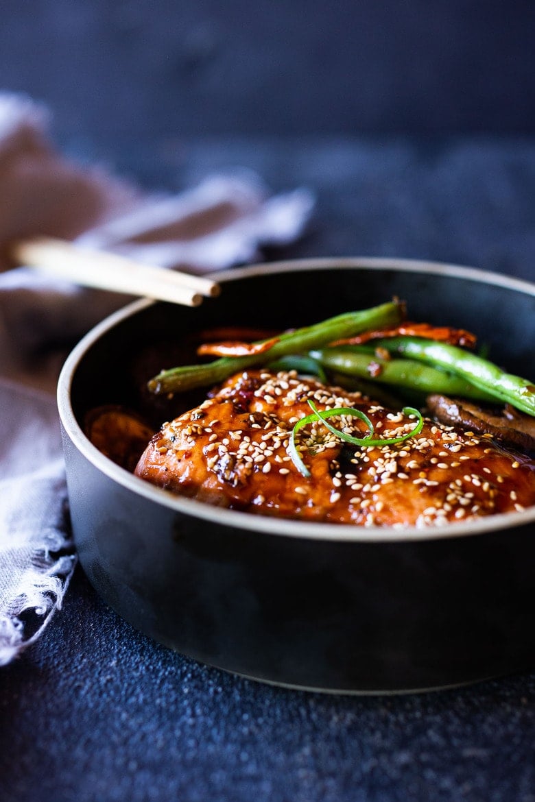 A tasty recipe for Sheet-Pan Szechuan Salmon with Scallion Green Beans baked in the oven that can be made in 30 minutes. A delicious healthy weeknight dinner! #szechuan #salmon #sheetpandinner 