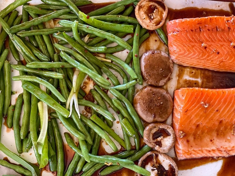 place the veggies and salmon on a sheet pan 