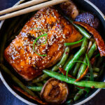 A tasty recipe for Szechuan Salmon with Scallion Green Beans baked in the oven that can be made in 30 minutes. A delicious healthy weeknight dinner! #szechuan #salmon