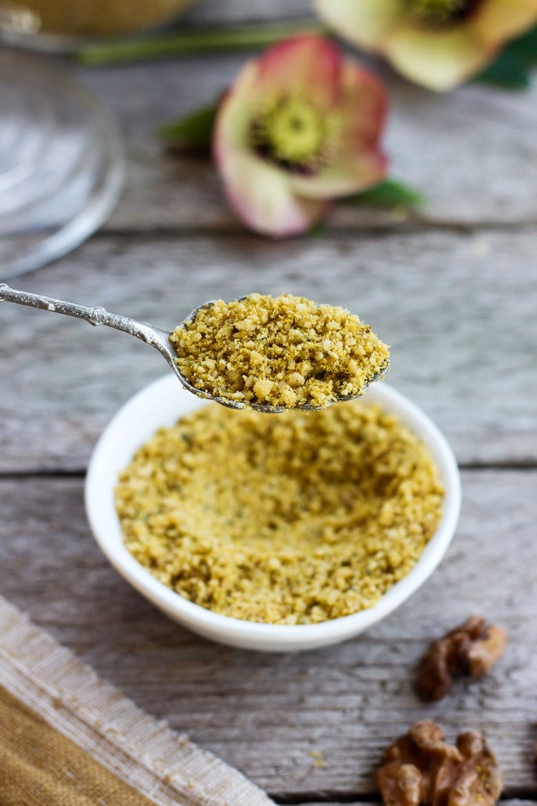 Vegan Cheesy Sprinkles! Give a little savory depth to your meals with this dairy-free rich topping. Perfect for pasta dishes, soups, and salads- a  great vegan substitute for parmesan cheese.  Easy to make in less than 20 minutes! #veganparmesan