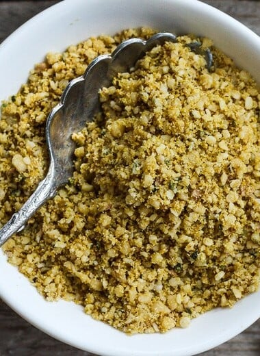 Vegan Cheesy Sprinkles! Give a little savory depth to your meals with this dairy-free rich topping. Perfect for pasta dishes, soups, and salads- a  great vegan substitute for parmesan cheese.  Easy to make in less than 20 minutes! #veganparmesan
