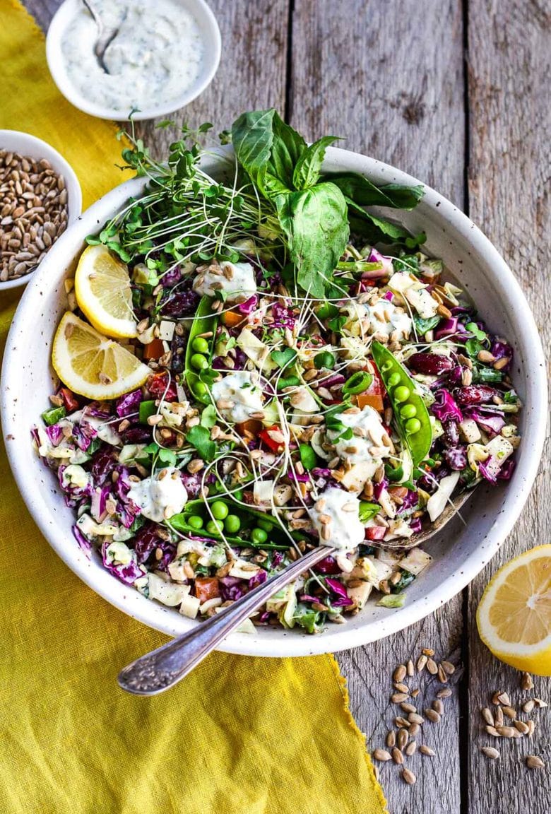 This Rainbow Chopped Salad is crunchy, colorful and nutritious! Tossed with a lemony herbed greek yogurt dressing, it is easy to make and easy to adapt. Perfect for meal prep, this salad keeps for 4 days in the fridge.
