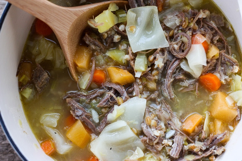 corned beef and cabbage stew simmering in a pot. 