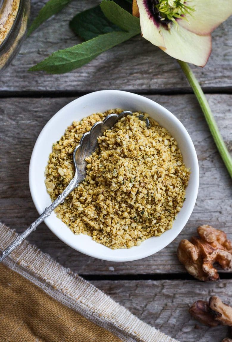 Vegan Cheesy Sprinkles! Give a little savory depth to your meals with this dairy-free rich topping. Perfect for pasta dishes, soups, and salads- a great vegan substitute for parmesan cheese. Easy to make in less than 20 minutes! #veganparmesan