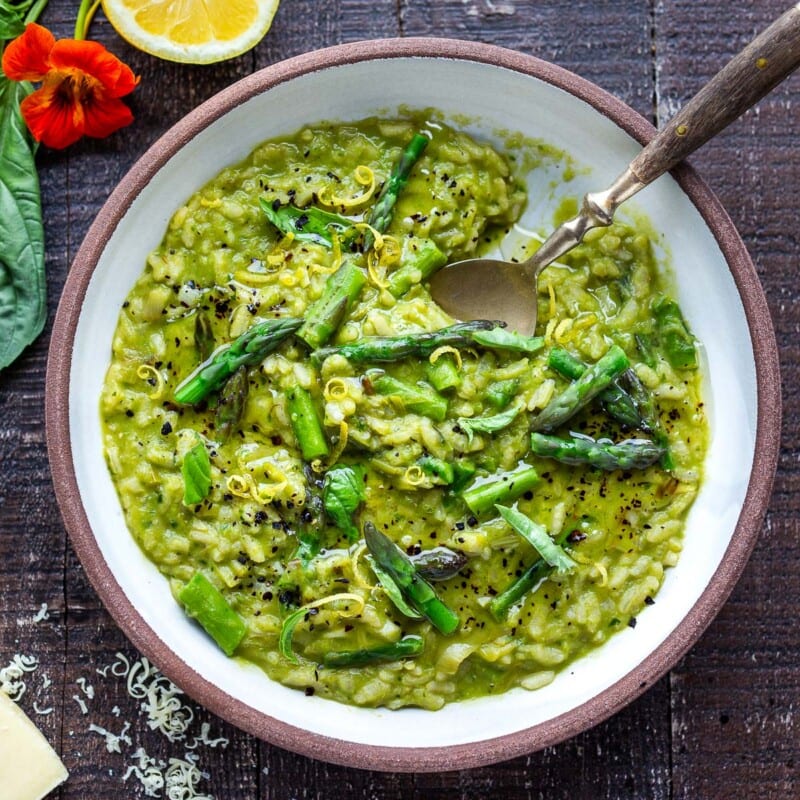 Lemony Asparagus Risotto with leeks and basil-light and creamy with vibrant color and flavor, perfect for spring! A tasty vegetarian meal, or beautiful base for fish, seafood or mushrooms! #asparagus #risotto #springrecipes