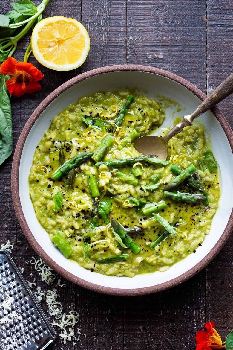 Lemony Asparagus Risotto with leeks and basil-light and creamy with vibrant color and flavor, perfect for spring! A tasty vegetarian meal, or beautiful base for fish, seafood or mushrooms!  #asparagus #risotto #springrecipes 