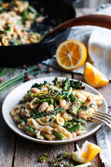 Charred Asparagus Kale Pasta with a creamy Cannellini Bean Leek Sauce.  This healthy, spring, vegan pasta recipe comes together in less than 30 minutes! #veganpasta #pasta #springpasta #asparaguspasta