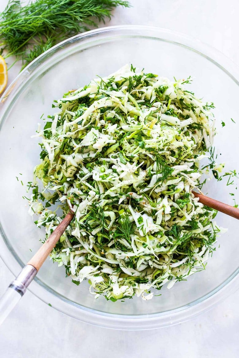 Simple Lebanese Slaw (aka Salatet Malfouf) made with crunchy cabbage, fresh herbs, lemon, garlic and scallions. A delicious vegan side to serve with your Middle Eastern feast. #slaw