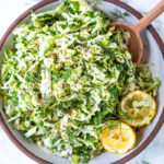 Simple Lebanese Slaw made with crunchy cabbage, fresh herbs, lemon, garlic and scallions. A delicious vegan side to serve with your Middle Eastern feast. #slaw