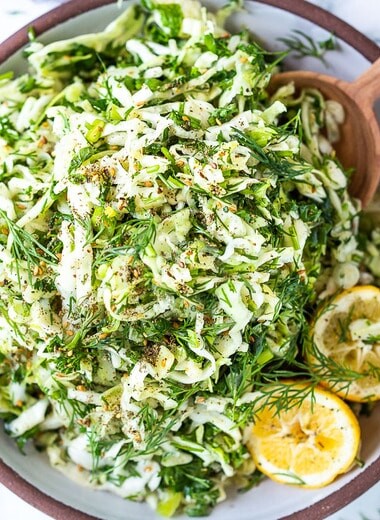 Simple Lebanese Slaw made with crunchy cabbage, fresh herbs, lemon, garlic and scallions. A delicious vegan side to serve with your Middle Eastern feast. #slaw