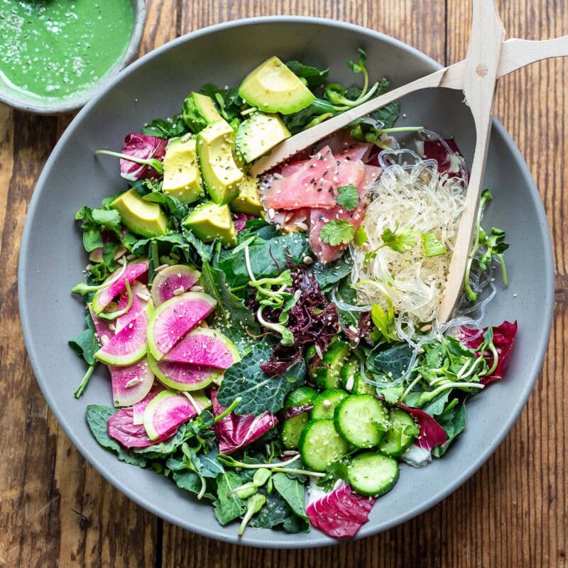 This unique seaweed salad recipe is the best! Made with dulse ribbons, kelp noodles, avocado, and greens, tossed in a spirulina dressing!