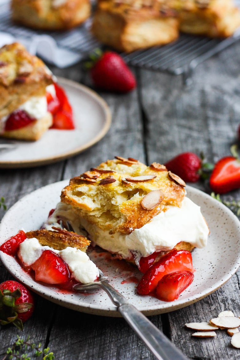 Homemade Strawberry Shortcake from Scratch with golden, flakey biscuits, jammy strawberry sauce, and yogurt whip cream.  The perfect American dessert with a twist.  This elevated version of the classic is subtly sweet and deeply satisfyinHomemade Strawberry Shortcake from Scratch with golden, flakey biscuits, jammy strawberry sauce, and yogurt whip cream.  The perfect American dessert with a twist.  This elevated version of the classic is subtly sweet and deeply satisfying. #strawberryshortcake. #strawberryshortcake