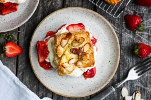 Homemade Strawberry Shortcake from Scratch with golden, flakey biscuits, jammy strawberry sauce, and yogurt whip cream.  The perfect American dessert with a twist.  This elevated version of the classic is subtly sweet and deeply satisfying. #strawberryshortcake