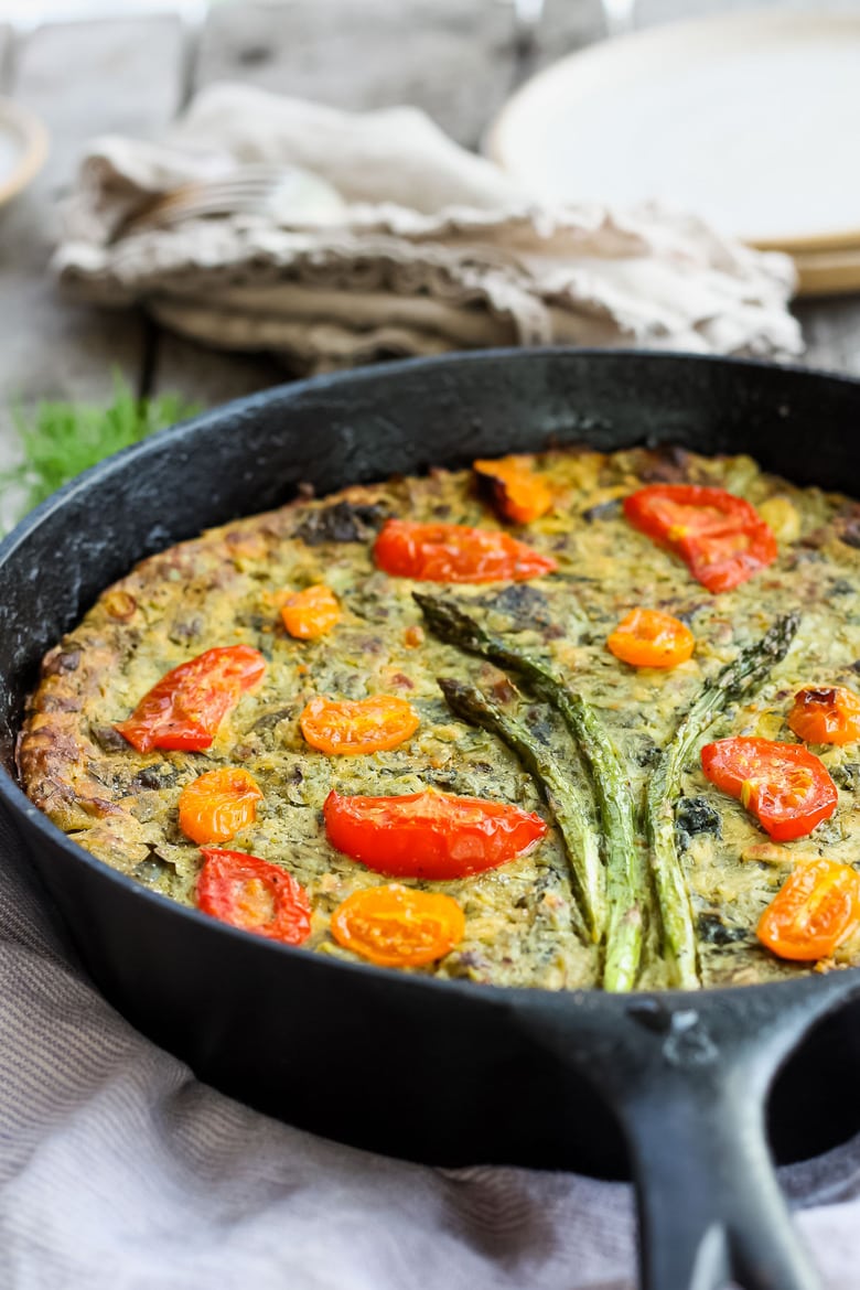 Springy Vegan Frittata stocked up with fresh herbs, leeks and asparagus and a flavorful creamy chickpea flour filling. #frittata #veganbreakfast #veganfrittata 