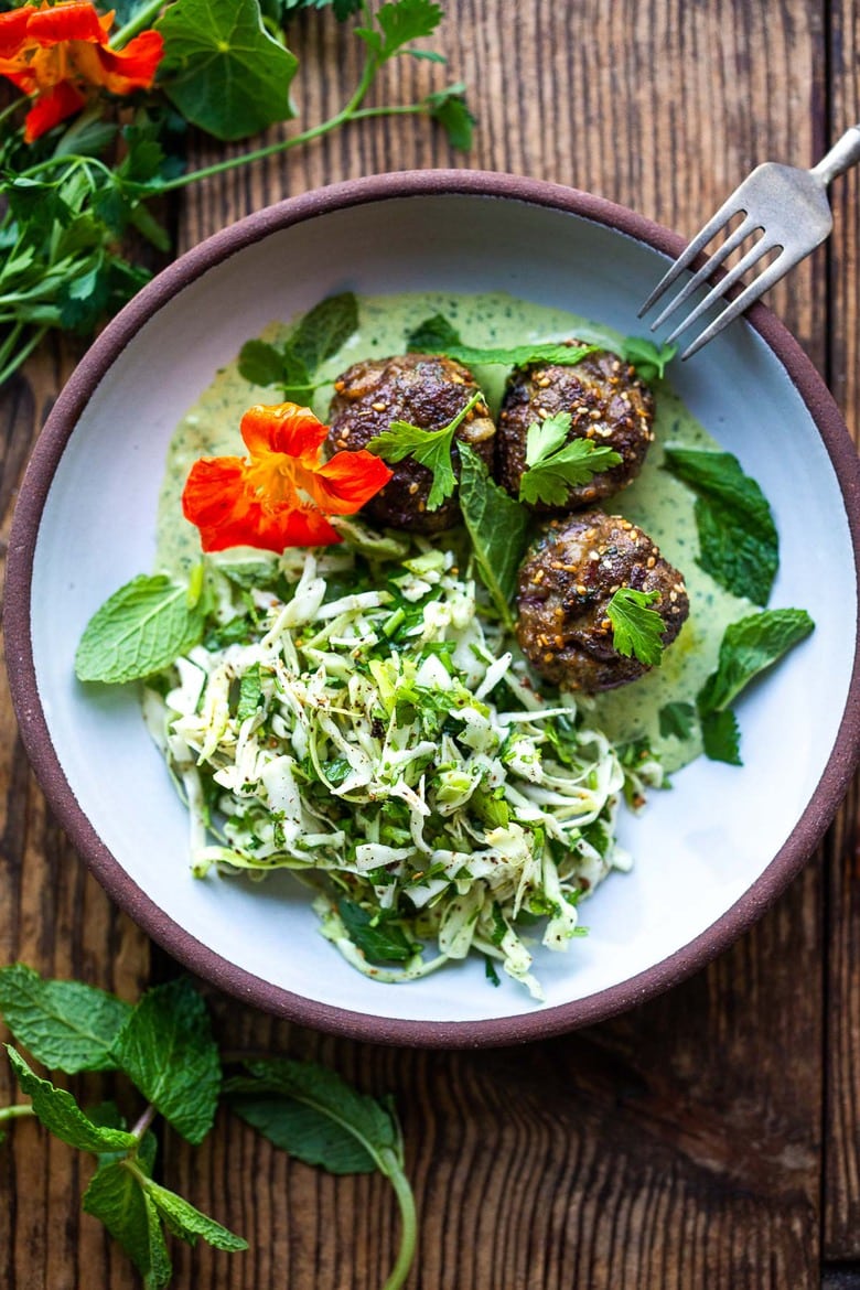 Zaatar Meatballs with Green Tahini Sauce can be made with ground turkey, chicken, lamb or beef. A quick, low-carb meal that is full of flavor. #meatballs #zaatar