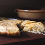 This classic Spanish Potato Tortilla (aka Tortilla de Patatas or Torta Espanola) is a lightened-up version made with thinly sliced potatoes, caramelized onions, eggs, and olive oil that can be served for tapas, breakfast, lunch or dinner. #spanishtortilla #tortilladepatatas #tortaespanola